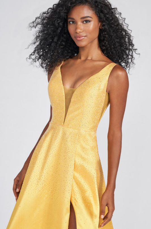 A-line silhouette with a plunging V-neck neckline by Ellie Wilde